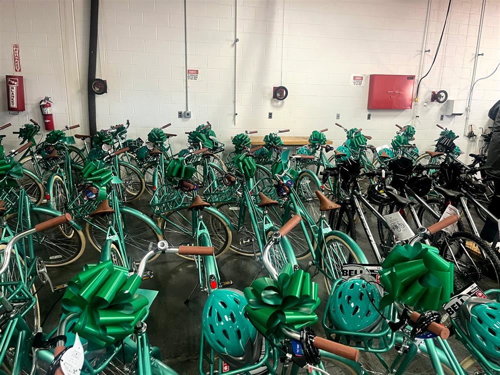  green bikes with green bows and helmets
